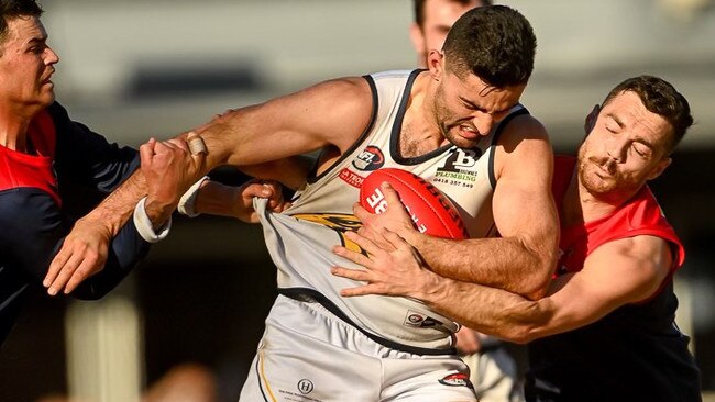 Whittlesea captain Xavier Dimasi can't escape two Diamond Creek tacklers. Picture: Field of View Photography