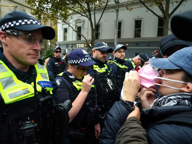 MELBOURNE AUSTRALIA - NewsWire Photos MAY 19, 2024: Pro-Palestinian protesters face off with police outside the Victorian Parliament.Picture: NCA NewsWire / Luis Enrique Ascui