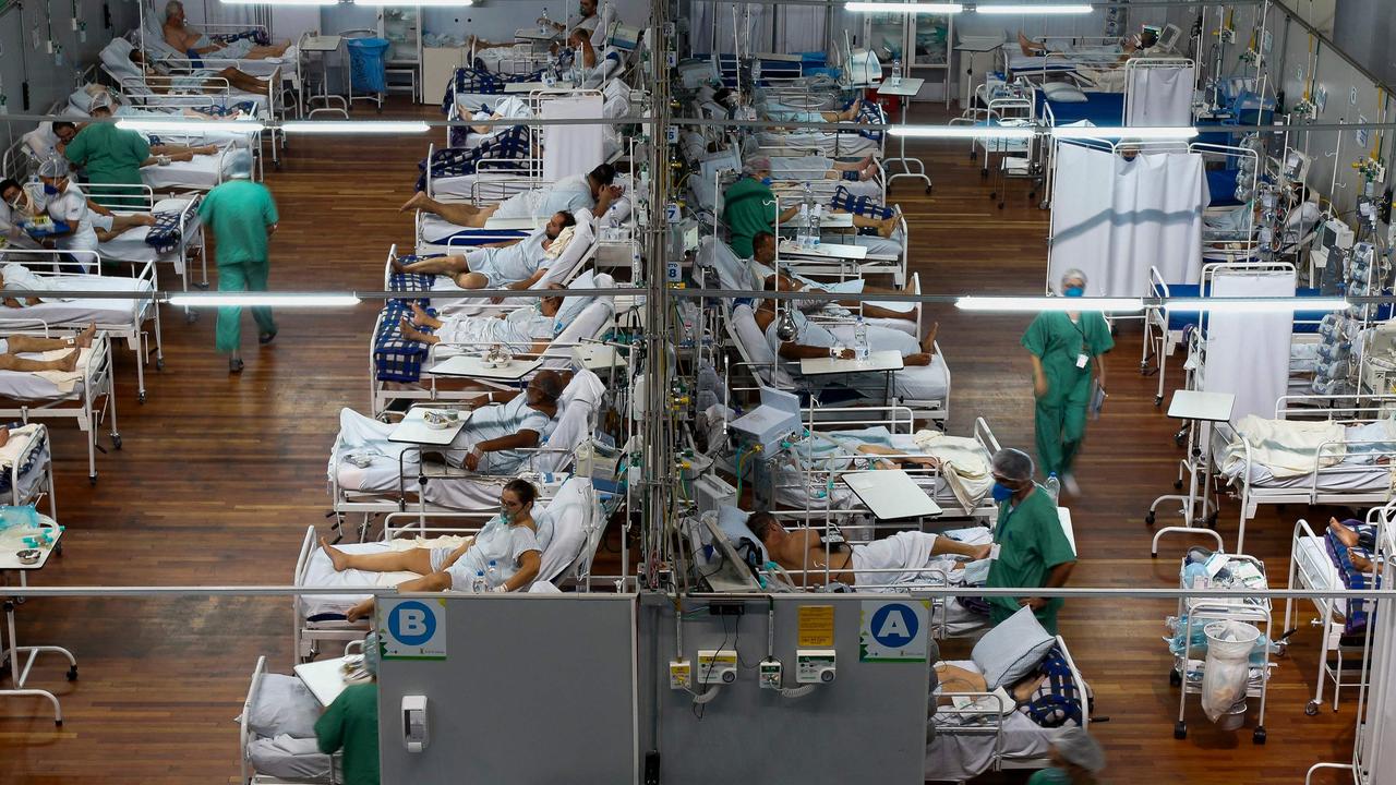 Patients affected by the COVID-19 coronavirus remain at a field hospital set up at a sports gym, in Santo Andre, Sao Paulo state, Brazil. Picture: Miguel Schincariol / AFP