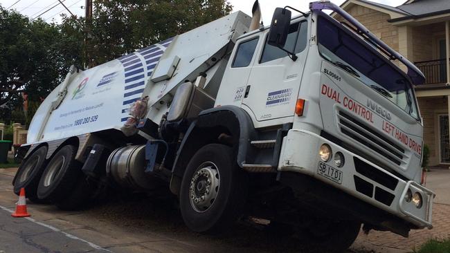 The rubbish truck in the sinkhole on Galway Ave at Broadview.