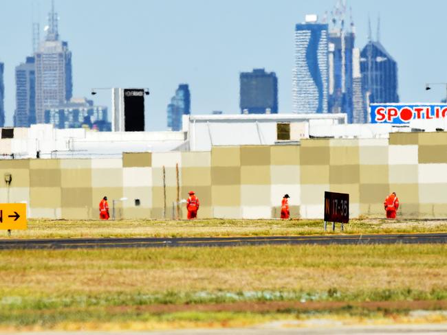 Authorities conduct a line search at Essendon airport. Picture: Rob Leeson