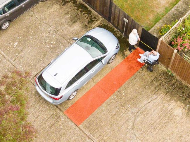 ONE TIME WEB USE ONLY - FEE APPLIES FOR REUSE -  An aerial view showing the disputed land in Maidenhead, Kent. See SWNS copy SWPATH: Neighbouring pensioners have forked out Â£121,000 on a fierce 10-year battle with each other -- over a 76cm strip of land in a car park near their homes. Great-grandparents Annette and Raymond Timmins have been arguing with neighbour Alan Soden, 85, over a gate at the back of his house which opens on to their parking space. Mr Soden threatened to take the couple to the High Court when his tenants complained the elderly pair were blocking the back gate with their car.  Picture: SWNS/Mega