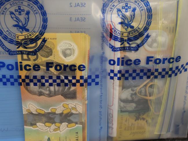 Large amounts of cash was also seized following the raids, which occurred after Hopkins’ arrest at Berkeley Vale. Picture: NSW Police