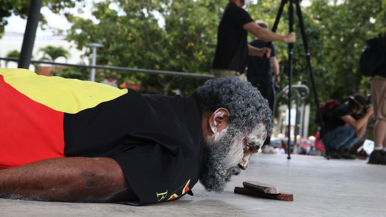 Colin Neal lies on the floor of the Fogarty Park stage in tribute for American man George Floyd killed by police. Picture: PETER CARRUTHERS