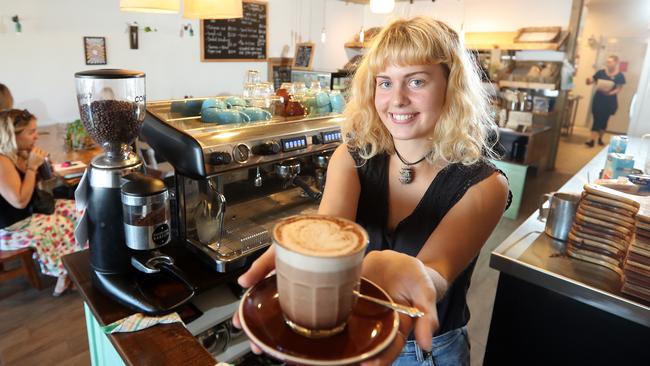 Gluten-free cafe and bakery Marie Anita has opened in Mermaid Beach this week. Photo of Milli Norman with a coffee. Photo by Richard Gosling