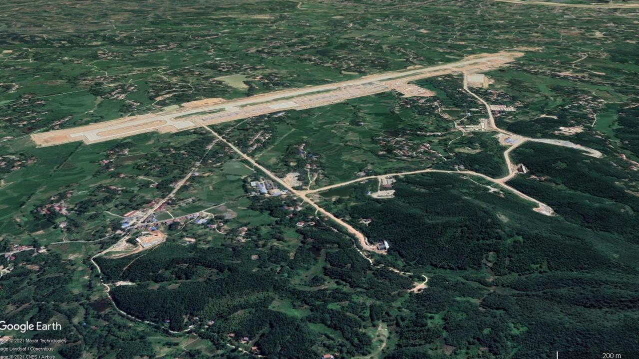 Lu’an airfield. The prominent taxiways extending from the airstrip lead to portals carved into the side of cliffs. Picture: Google Earth