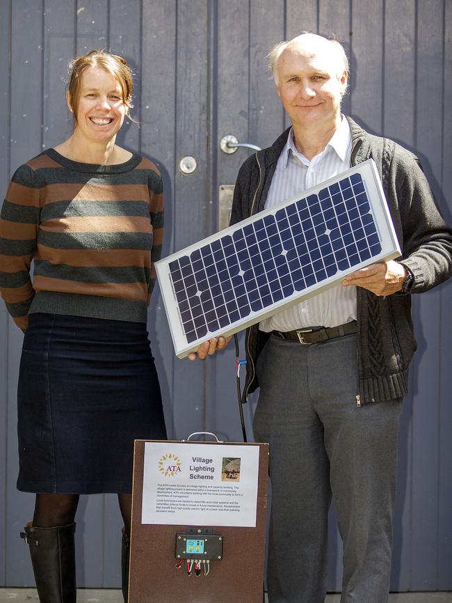 Mick Harris and Donna Luckman pictured with an example of the solar unit being installed in Timor.