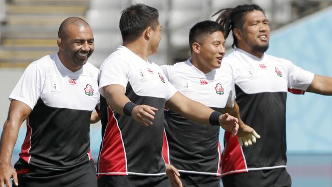 Japan rugby union team players with captain Michael Leitch, center left, attend a training session in Tokyo, Japan, Thursday, Sept. 19, 2019. The Rugby World Cup starts Friday, Sept. 20, with Japan playing Russia, and ends with the final on Nov. 2. (AP Photo/Christophe Ena)