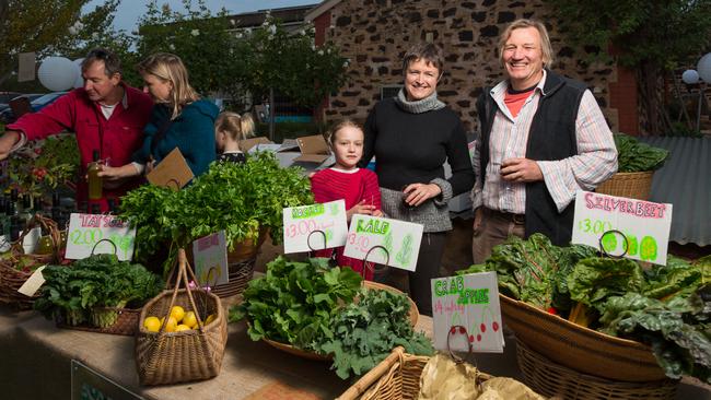 Penny Rafferty, Mike Collett and Matilda Collett who sell homegrown produce at the Full Moon Farmgate market in the Barossa.