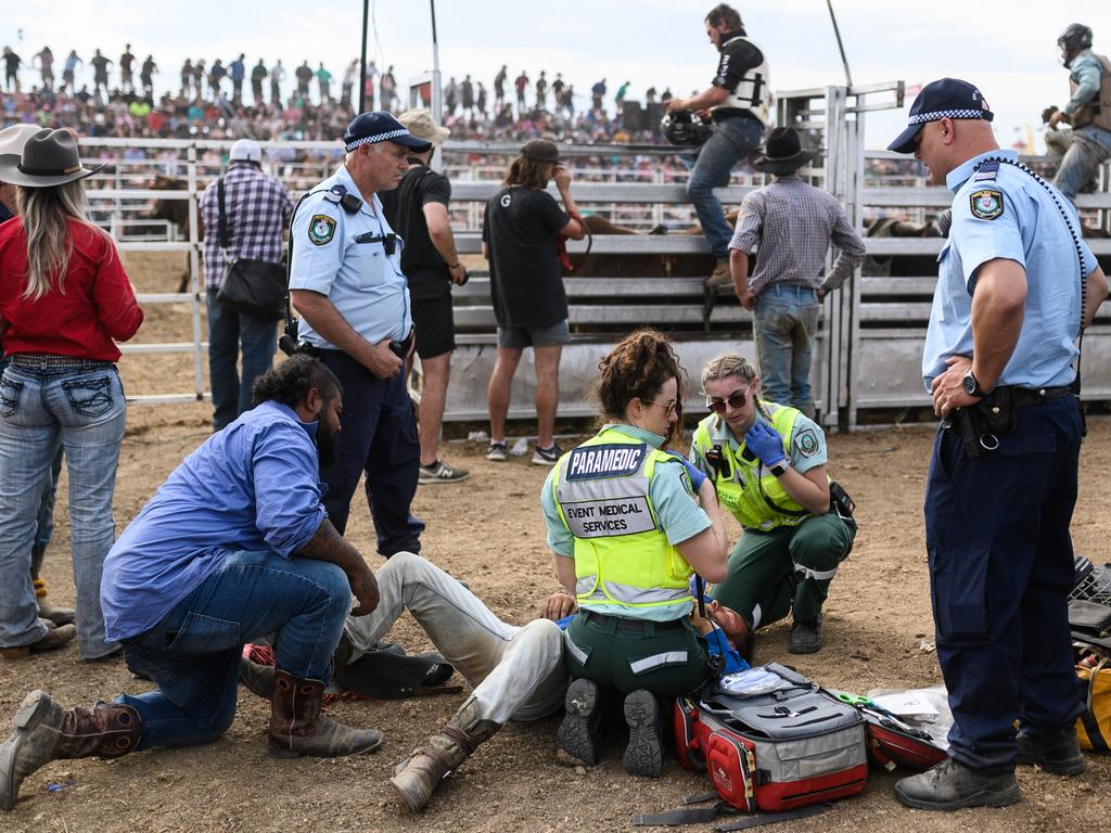 A bull rider being treated by Paramedics after being trampled by a bull. Picture: James Gourley/Getty Images