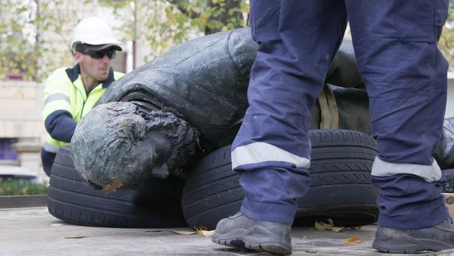 Council workers remove the statue. The William Crowther statue in Franklin Square Hobart has been vandalised overnight resulting in the statue being removed from it's plinth and then removed by Hobart City Council. Picture: Nikki Davis-Jones