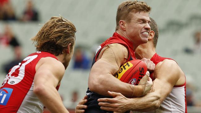 Colin Sylvia tries to burst through a tackle.