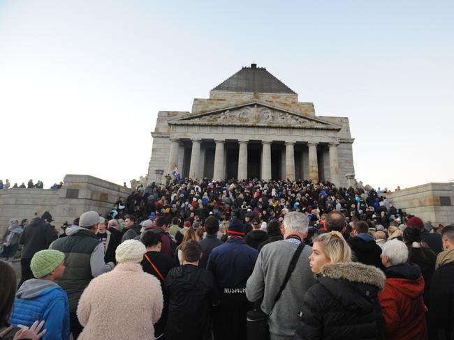 Streaming into the Shrine to lay poppies. Picture: Andrew Henshaw