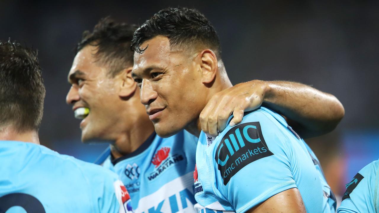 Karmichael Hunt and Israel Folau of the Waratahs celebrate a try last month.