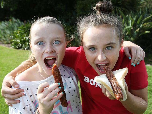 Tallulah and Matisse, 11, enjoy sausages in moderation. Picture: Yuri Kouzmin