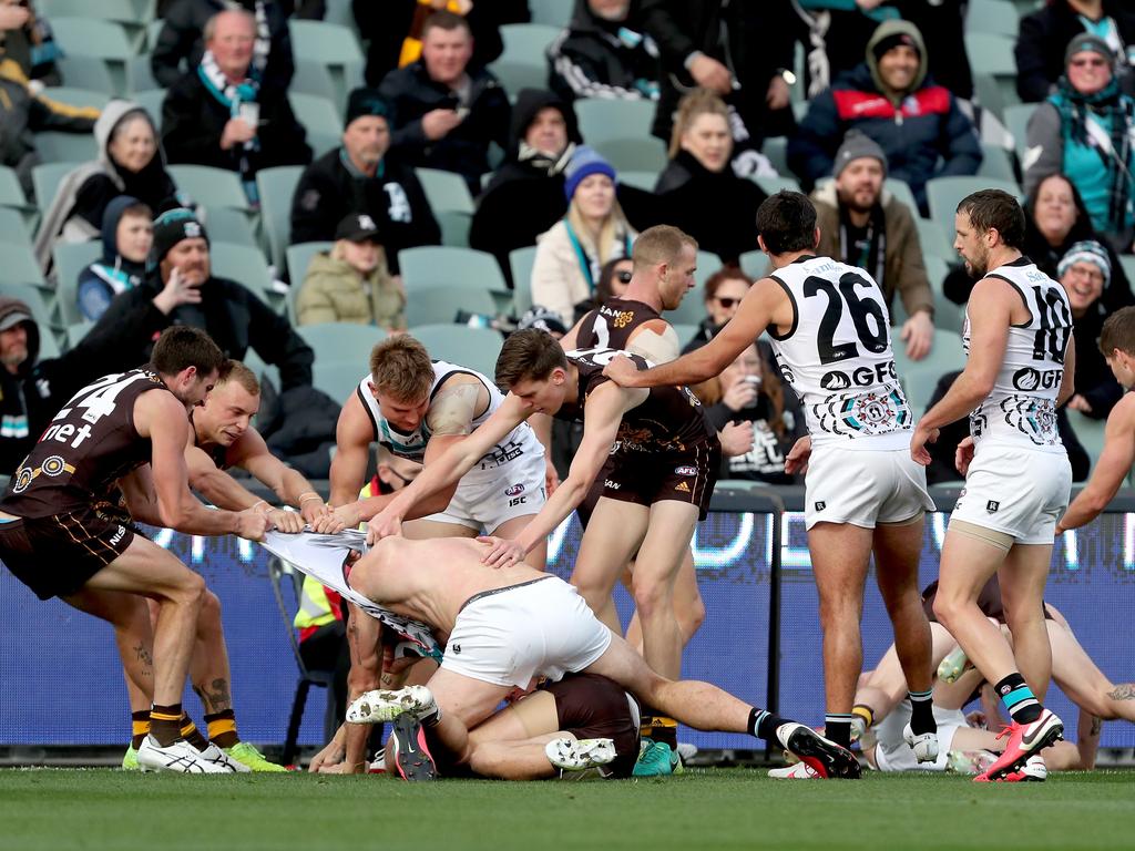 Charlie Dixon losing his shirt in a melee.