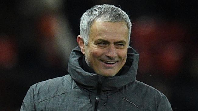 Manchester United's Portuguese manager Jose Mourinho laughs on the thouchline during the English Premier League football match between Manchester United and Manchester City at Old Trafford in Manchester, north west England, on December 10, 2017. / AFP PHOTO / Oli SCARFF / RESTRICTED TO EDITORIAL USE. No use with unauthorized audio, video, data, fixture lists, club/league logos or 'live' services. Online in-match use limited to 75 images, no video emulation. No use in betting, games or single club/league/player publications.  /