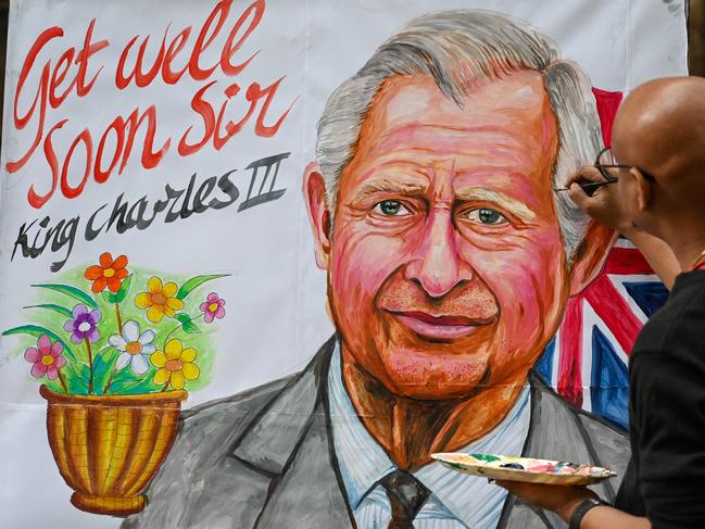 An artist gives finishing touches to a painting of King Charles III to wish him a speedy recovery. Picture: AFP