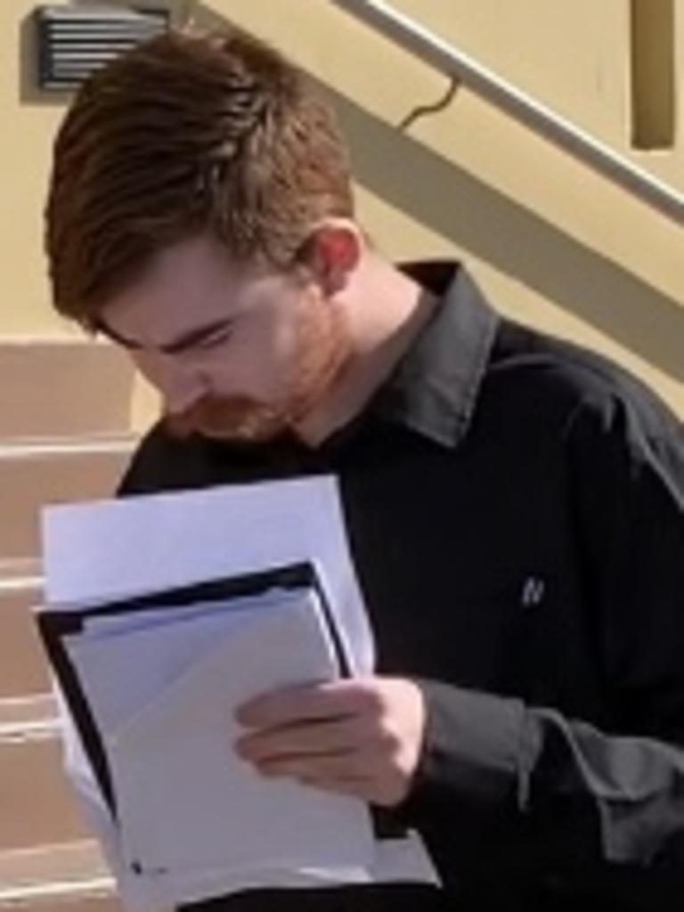 Tyler Jay Halliday leaves Mackay Magistrates Court after pleading guilty to hitting, kicking and spitting on his former girlfriend's dog in a "disgusting" attack. Photo: Janessa Ekert