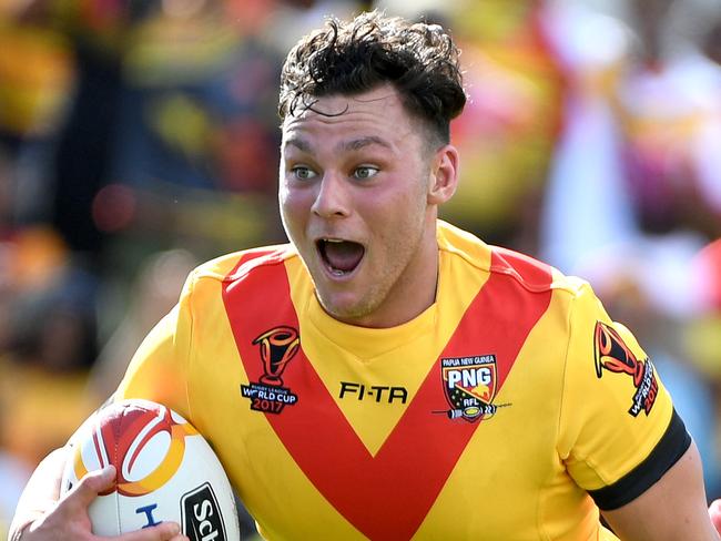 Lachlan Lam of Papua New Guinea smiles as he scores a try, during the Pool C, round 3 Rugby League World Cup match between Papua New Guinea and the USA at the Oil Research National Football stadium in Port Moresby Papua New Guinea, Sunday, November 12, 2017. (AAP Image/Joe Castro) NO ARCHIVING, EDITORIAL USE ONLY