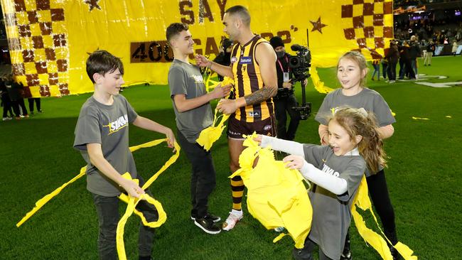 Burgoyne with his children after they ensured there would be no slip up for their dad when breaking through his 400 banner.