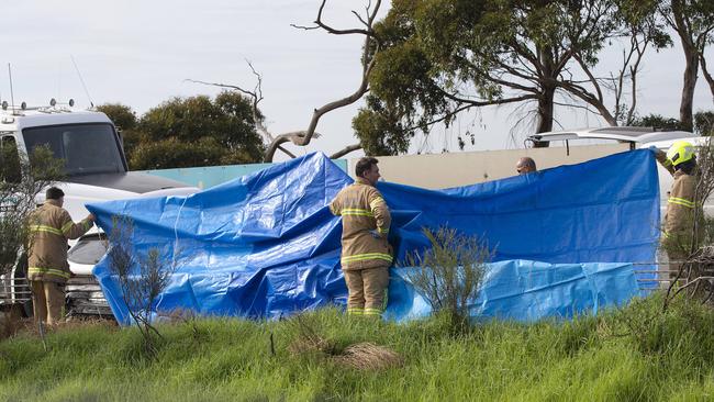 A person has died after a truck collided with a car on the Princes Freeway.