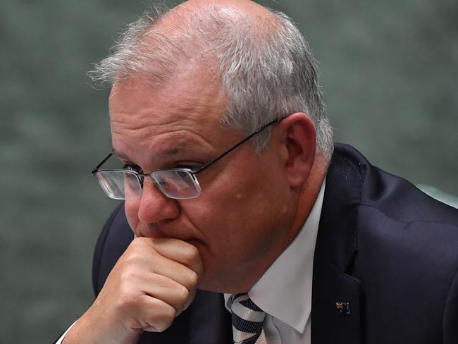 CANBERRA, AUSTRALIA - MARCH 25: Prime Minister Scott Morrison reacts during Question Time in the House of Representatives at Parliament House on March 25, 2021 in Canberra, Australia. The federal government was on Monday set back by new allegationsÃÂ broadcastÃÂ by the Ten Network after pixelated images of unnamed Coalition advisers allegedly engaging in performing lewd sex acts on the desks of female MPs resulting in a Morrison staff member being sacked last night. Additionally, the ABC Network aired a first hand account by an Australian Parliament security guard of what she witnessed on the night Brittany Higgins was allegedly raped in the office of then-defence industry minister Linda Reynolds in early 2019. (Photo by Sam Mooy/Getty Images)