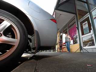 Little Delhi co-owners Chris and Gail Warid are concerned by the lack of space on the footpath when cars overstep the car park in front of their store along Carrington Street. Picture: Marc Stapelberg