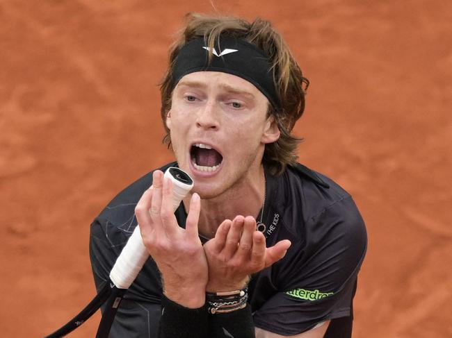 Russia's Andrey Rublev reacts as he plays against Italia's Matteo Arnaldi during their men's singles match on Court Suzanne-Lenglen on day six of the French Open tennis tournament at the Roland Garros Complex in Paris on May 31, 2024. (Photo by Bertrand GUAY / AFP)