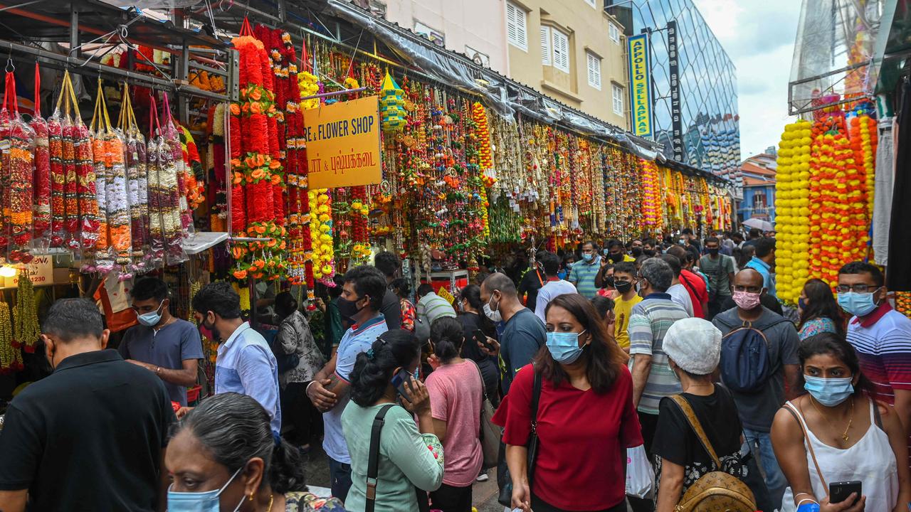 While extended restrictions tempered crowds to an extent, many Singaporeans still took to the streets this week to celebrate the Hindu festival of Diwali. Picture: Roslan Rahman/AFP