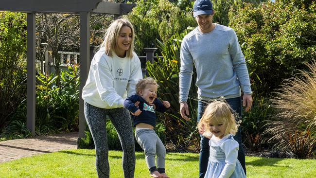 Tim Paine with wife Bonnie and children at home in South Hobart. Picture: Chris Crerar