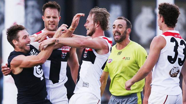 MELBOURNE, AUSTRALIA — FEBRUARY 28: Dale Thomas of the Blues (L) and Jimmy Webster of the Saints wrestle in a melee after Jack Sinclair of the Saints was hit late by Kade Simpson of the Blues during the JLT Community Series AFL match between the Carlton Blues and the St Kilda Saints at Ikon Park on February 28, 2018 in Melbourne, Australia. (Photo by Michael Dodge/Getty Images)