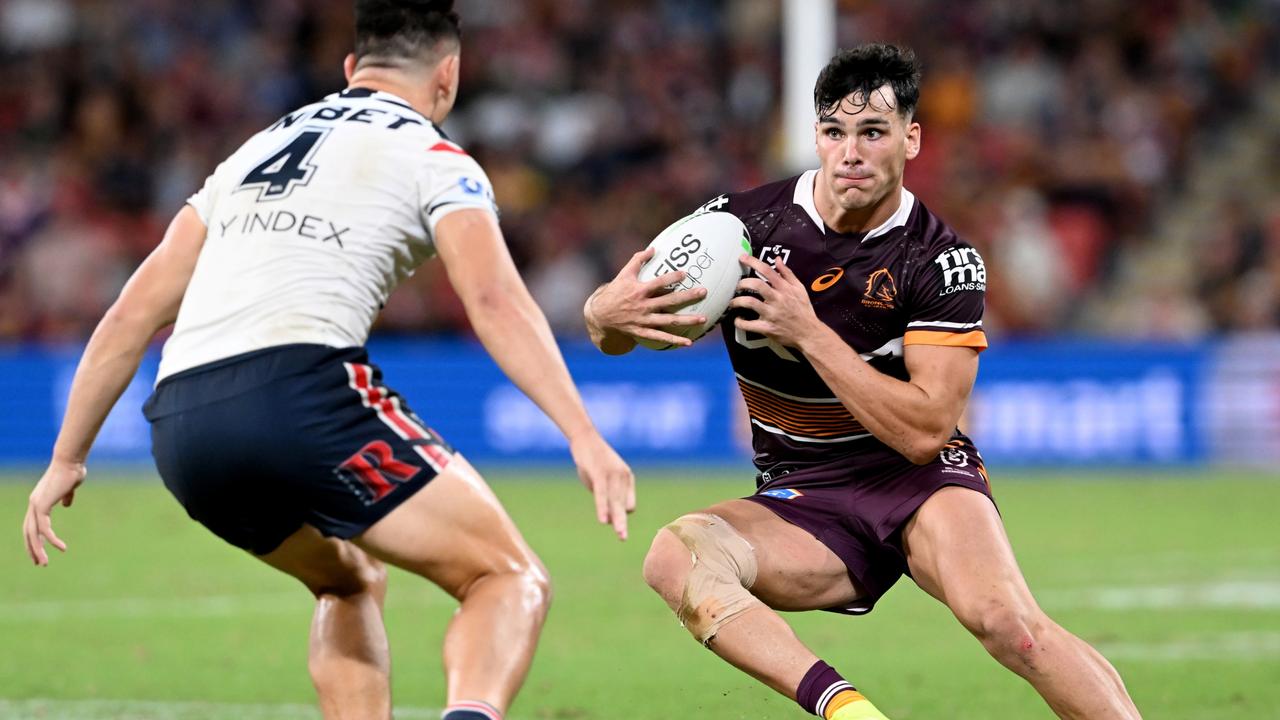 BRISBANE, AUSTRALIA - APRIL 08: Herbie Farnworth of the Broncos looks to takes on the defence of Joseph Manu of the Roosters during the round five NRL match between the Brisbane Broncos and the Sydney Roosters at Suncorp Stadium, on April 08, 2022, in Brisbane, Australia. (Photo by Bradley Kanaris/Getty Images)