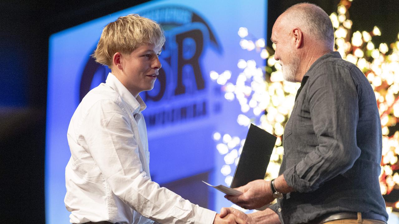 Sports Darling Downs Junior Rising Star award recipient Bryce Krause accepts the award from Darren Holmes at the presentation dinner at Rumours International, Saturday, February 1, 2025. Picture: Kevin Farmer