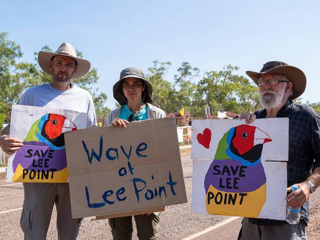 Tobias Akesson, Mona Benson and Dr Ian Hance participate in the Lee Point Defence Housing Australia Development protest as bulldozers move in on Stage 2 of the project. Picture: Pema Tamang Pakhrin