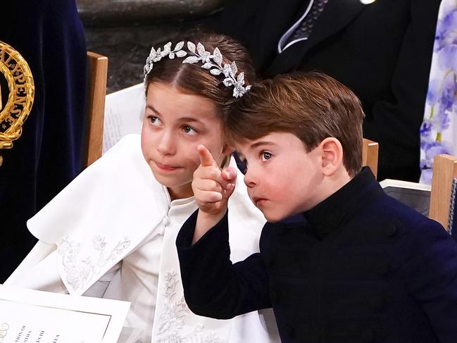 An animated Prince Louis points something out to sister Princess Charlotte. Picture: Getty Images