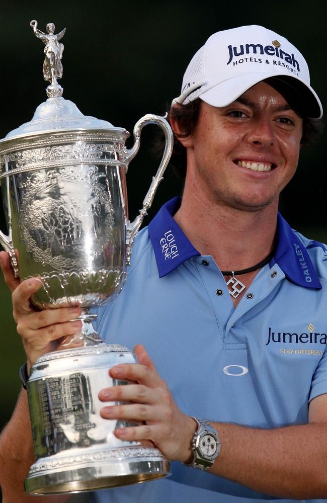 19/06/2011 WIRE: BETHESDA, MD - JUNE 19: Rory McIlroy of Northern Ireland poses with the trophy after his eight-stroke victory on the 18th green during the 111th U.S. Open at Congressional Country Club on June 19, 2011 in Bethesda, Maryland. Andrew Redington/Getty Images/AFP== FOR NEWSPAPERS, INTERNET, TELCOS & TELEVISION USE ONLY ==