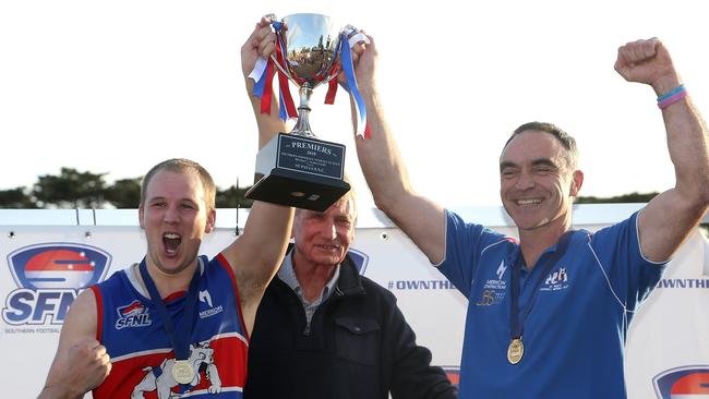 Kieran Knox (L) and Jason Heffernan raise the 2018 SFNL Division 1 silverware. Picture: Hamish Blair