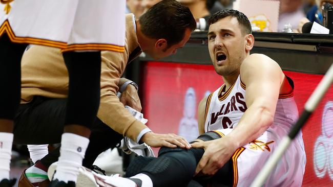 Andrew Bogut reacts after getting hurt in his first game for the Cavs in March.