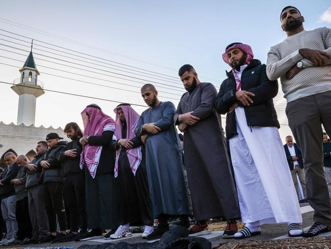 Worshippers participate in Eid al-Fitr prayers, marking the end of the holy month of Ramadan, outside the Lakemba Mosque in Sydney on April 10, 2024. (Photo by DAVID GRAY / AFP)