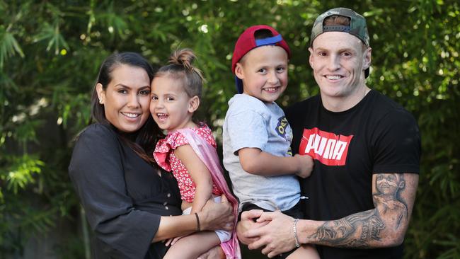 Mitch Robinson with his partner Emma MacNeill and their kids Charli and Chance last year. Picture: Annette Dew