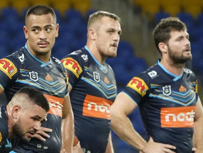 Titans players stand dejected following an Eels try during the Round 2 NRL match between the Gold Coast Titans and the Parramatta Eels at CBus Super Stadium on the Gold Coast, Sunday, March 22, 2020. (AAP Image/Dave Hunt) NO ARCHIVING, EDITORIAL USE ONLY