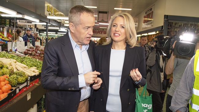 Opposition Leader Bill Shorten and wife Chloe Shorten talk to shoppers and traders at Big Sams St Albans Market in Melbourne on Saturday.