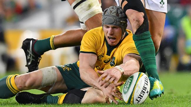 David Pocock of the Wallabies dives on the ball during the First Test between Australia and Ireland at Suncorp Stadium in Brisbane on Saturday.