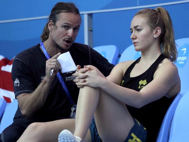 Australian swimmer Ariane Titmus talks with her coach Dean Boxall at the World Swimming Championships in Gwangju, South Korea in July. Picture: AP/Lee Jin-man