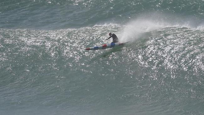 Gold Coast ocean athlete Phil Clayton rides a monster wave at Burleigh on Sunday. Picture: Instagram/@photowilba