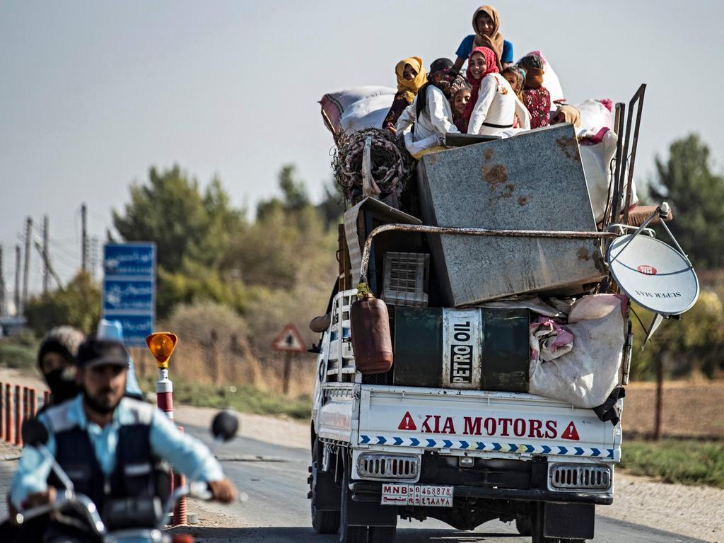 Syrian Arab and Kurdish civilians arrive to Tall Tamr town, in the Syrian northwestern Hasakeh province, after fleeing Turkish bombardment on the northeastern towns along the Turkish border on October 10, 2019. Picture: Delil SOULEIMAN / AFP.