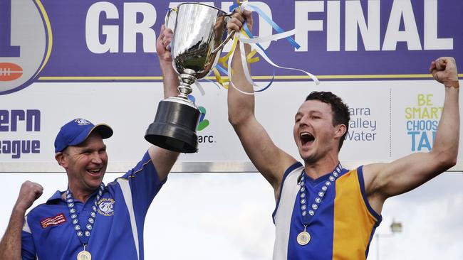 Macleod coach Garry Ramsay and captain Kane Shaw lift the 2015 NFL Division 1 premiership cup. Picture: Hamish Blair