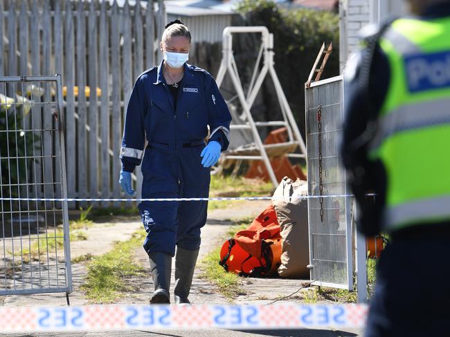 Investigators are seen at a property in Marnoo Street, Norlane in Geelong, Wednesday, September 11, 2019. Possible human bones have been uncovered during an excavation at a Geelong property with homicide squad detectives investigating the find. (AAP Image/Julian Smith) NO ARCHIVING