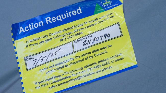 Brisbane City Council have plastered stickers on tents in Musgrave Park, located in South Brisbane, warning owners that if they were not collected by May 7, they may be confiscated or disposed of. Picture: NewsWire / Glenn Campbell